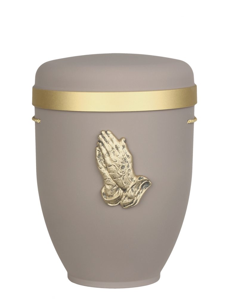 Naturfaserurne, matt pastellbraun, Goldrand breit mit aufgesetztem Emblem „Dekor-Emblem bet. Hände“ in Gold