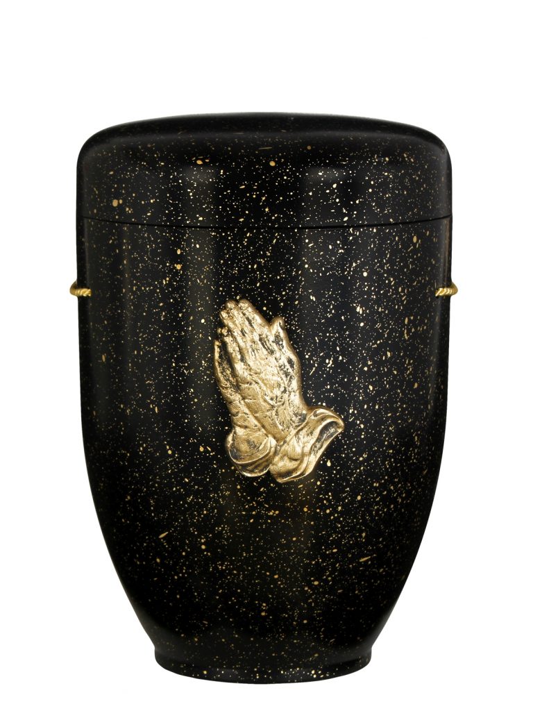 Biologisch abbaubare Urne in Schwarz mit goldenen Betenden Händen, gesprenkelte Oberfläche