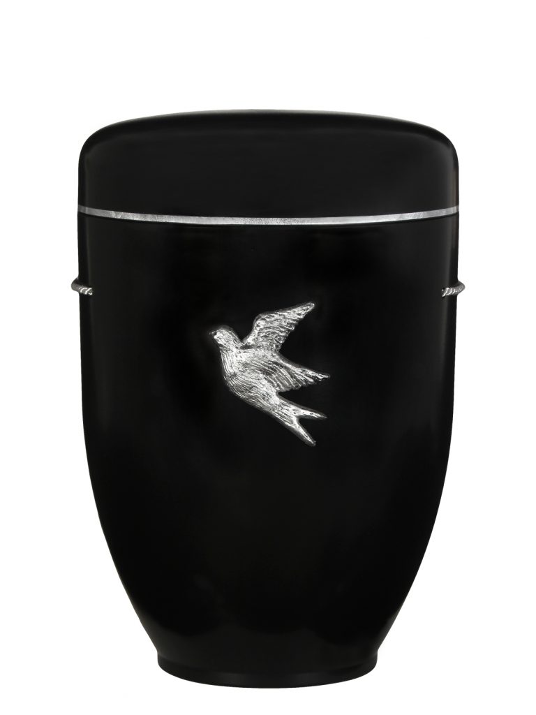 Schwarze biologisch abbaubare Urne mit silberner Taube als Symbol für Frieden.