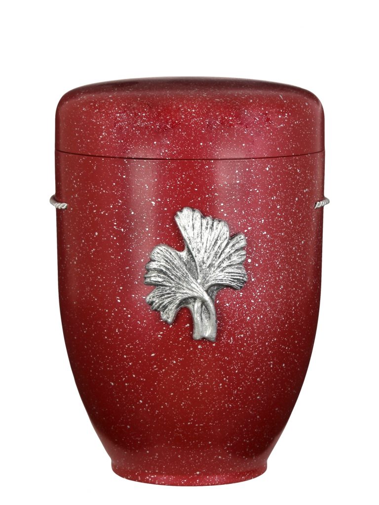 Biologisch abbaubare Urne in Rot mit silbernem Ginkgo-Symbol.