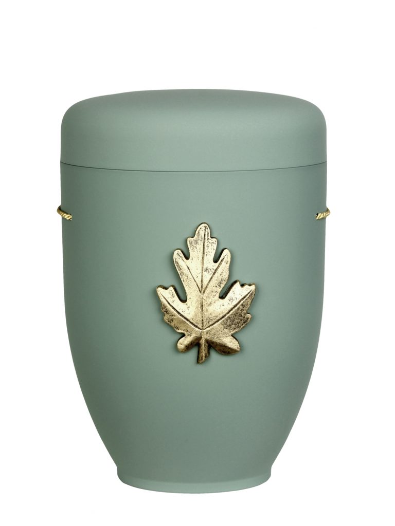 Naturfaserurne, matt mint, ohne Randt mit aufgesetztem Emblem „Motiv D10“ in Gold